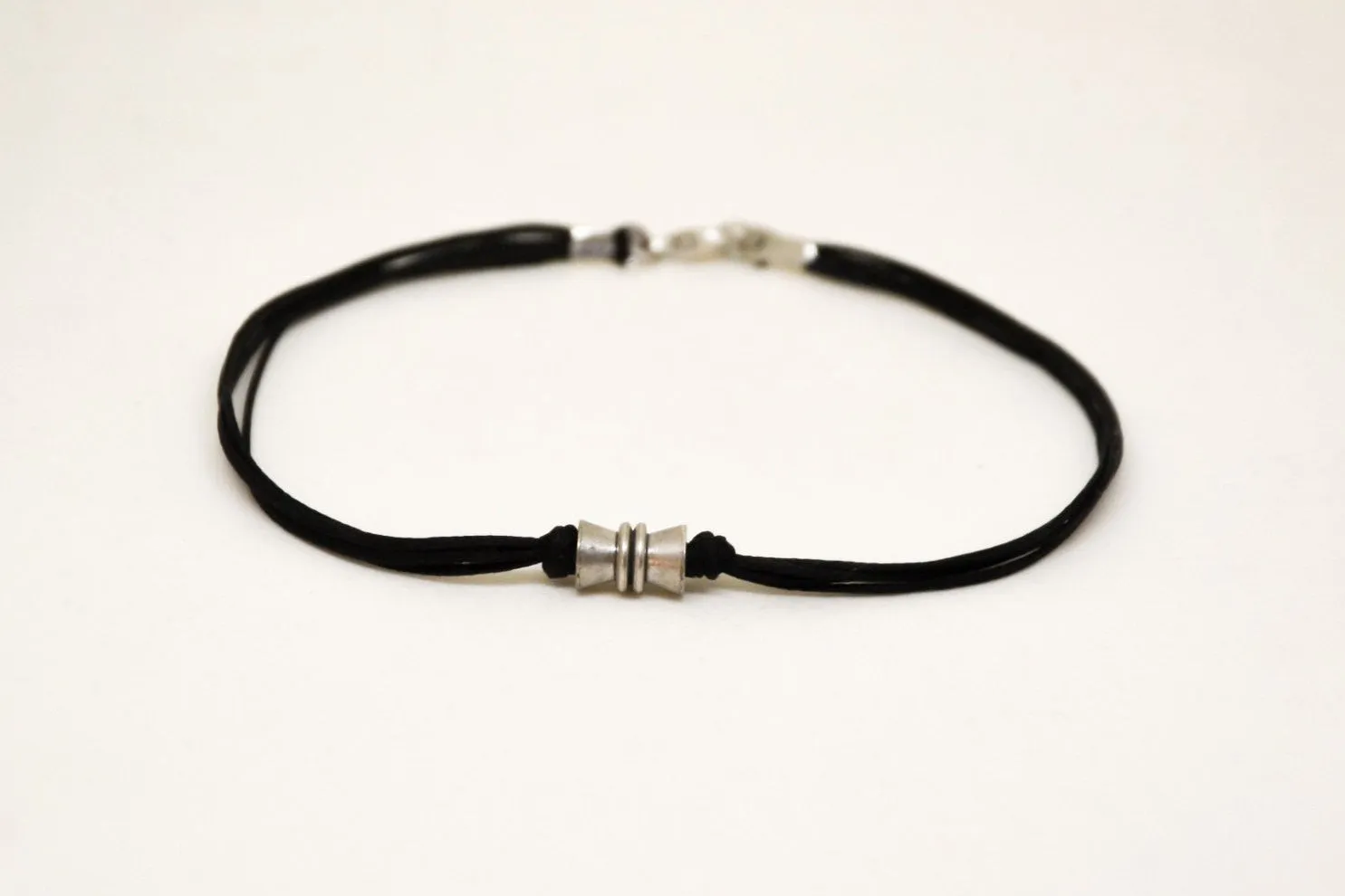 Men's anklet with a silver tube bead charm and a black cord, gift for him